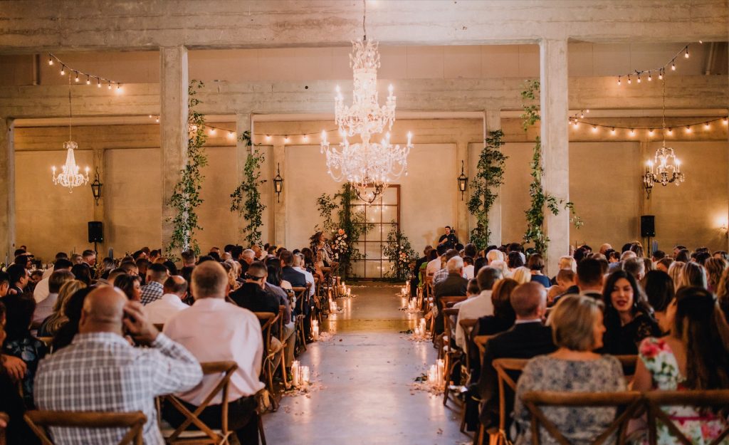 The Willow Ballroom indoor ceremony with chandelier focal