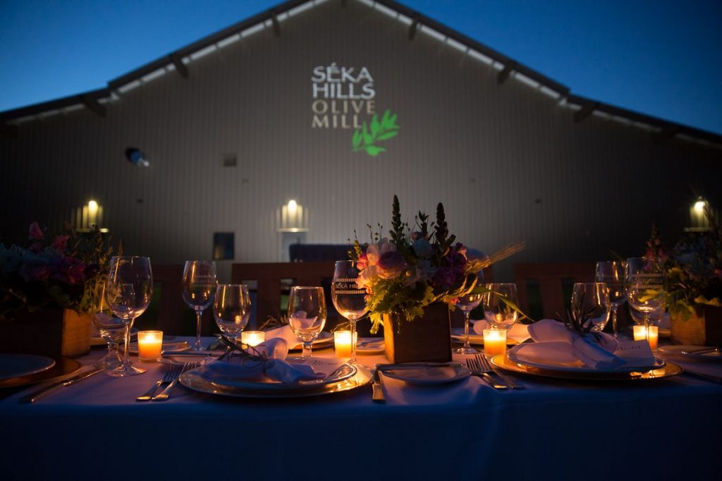 Seka Hills, Yolo County Modern Barn tasting room nighttime exterior lights