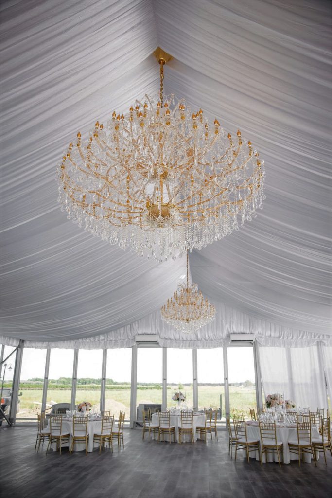 Lakeview Estates. Private Estate along a private lake. Inside the white marquee tent. Beautiful chandeliers.