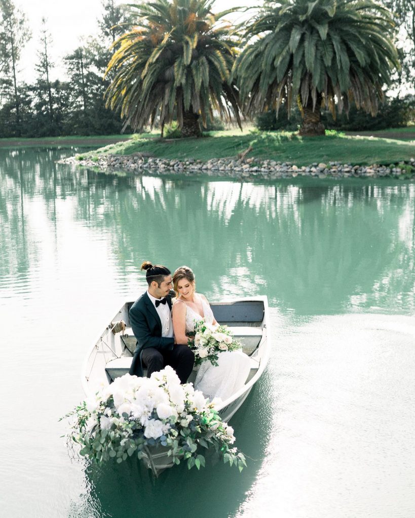 Lakeview Estates. Private Estate along a private lake Couple in flower laden canoe. .