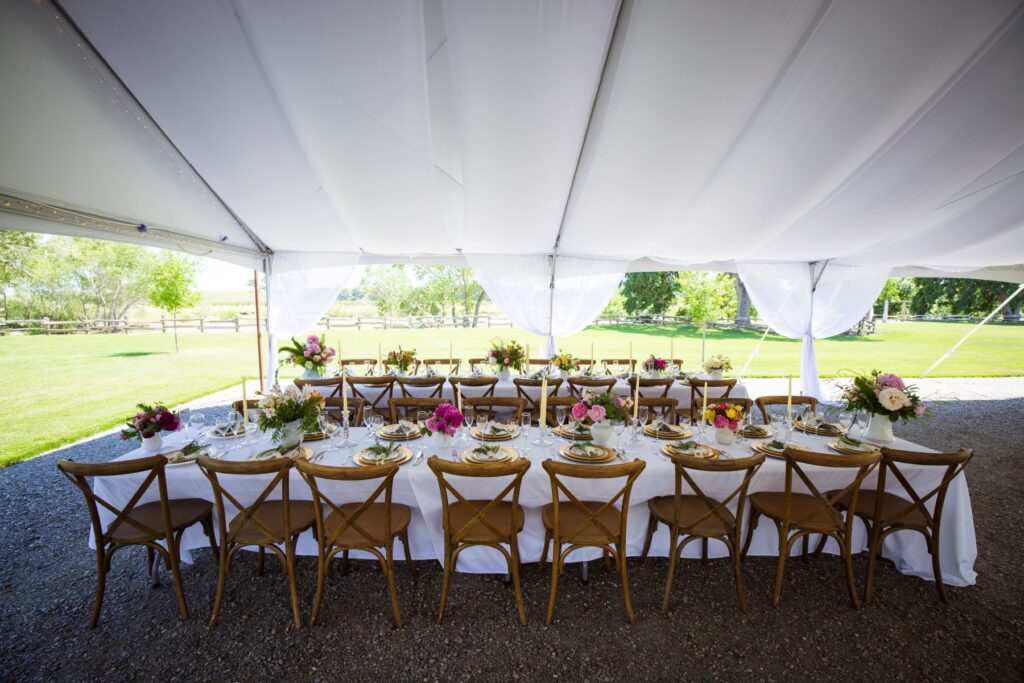 Crossing at Thomes Creek Wedding Events. Tables set up under the tent.