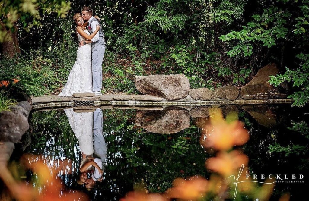 Flower Farm Inn Norcal Wedding Events Romantic kiss at the pond