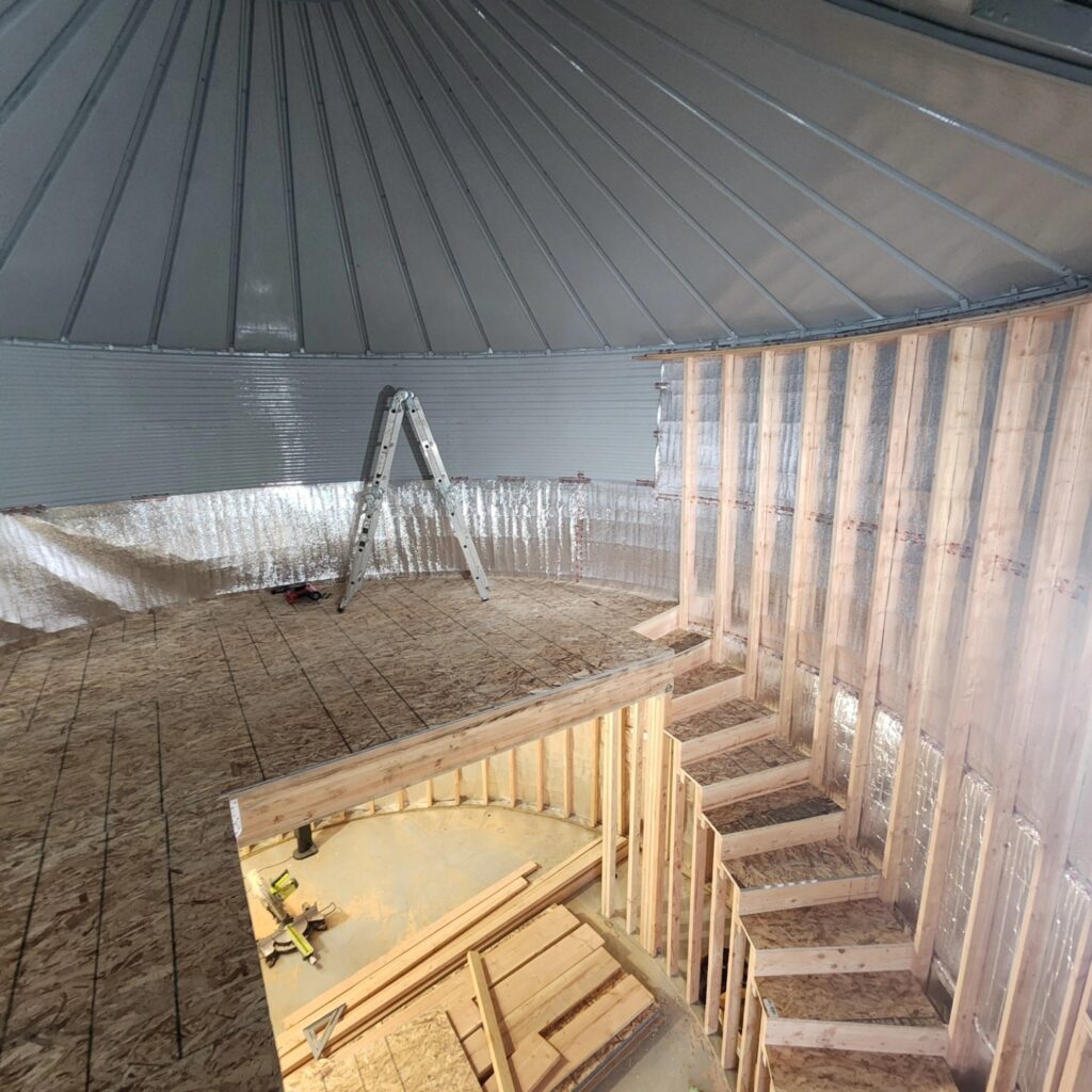 Construction of the bridal changing rooms in the grain bin.