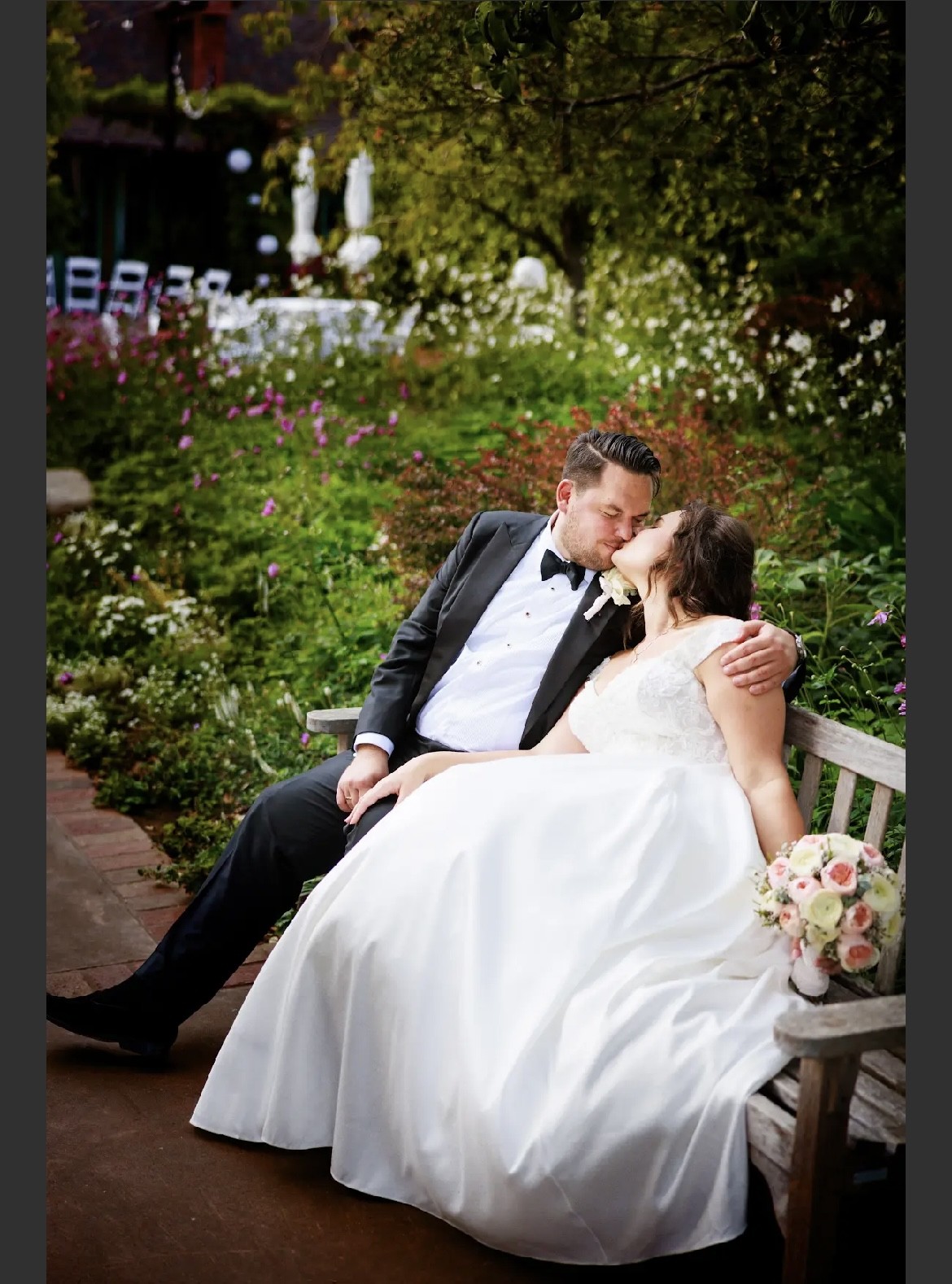 Mischa Photography, Nor Cal Photographer.  Couple on bench kissing.